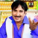 Rajesh Singhpuria Haryanvi singer in blue shirt - Peddler Media