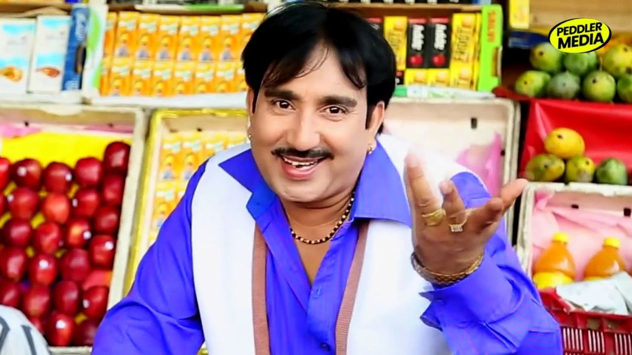 Rajesh Singhpuria Haryanvi singer in blue shirt - Peddler Media