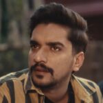 Ron Likhari close-up emotional expression from Timelapse Haryanvi song video