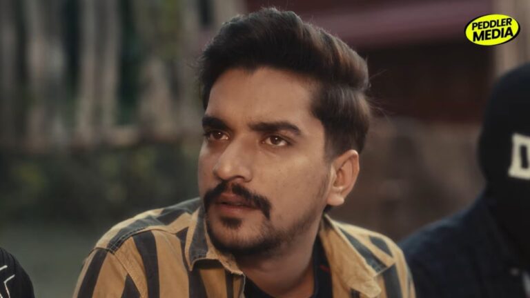 Ron Likhari close-up emotional expression from Timelapse Haryanvi song video