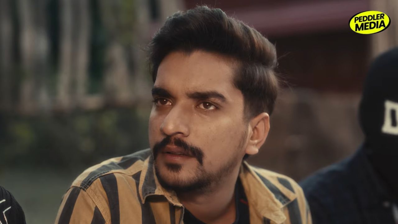 Ron Likhari close-up emotional expression from Timelapse Haryanvi song video