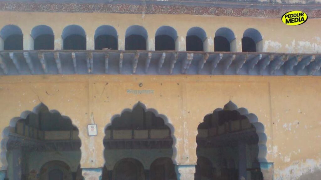 Abandoned Chaupal of Rithal village in Rohtak, Haryana — two-storey structure with arched windows and scalloped arches showing years of neglect