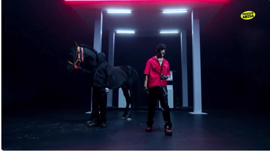 Billa Sonipat Ala red oversized shirt black leather pants in Challenge music video