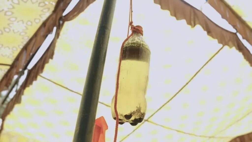 Dirty water from Chanot village Hisar displayed at protest site