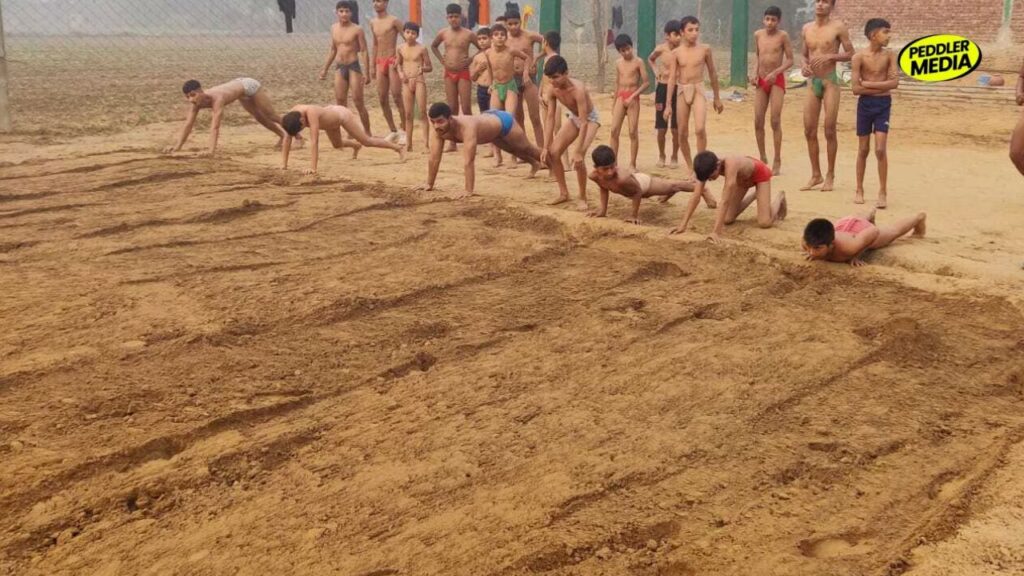 oung wrestlers training at a Haryana village akhara — the grassroots foundation behind Haryana Olympic medals