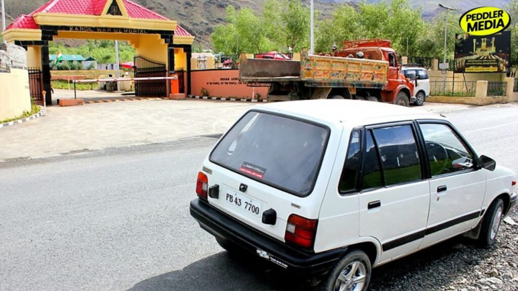 1997 Maruti 800 PB 43 7700 parked outside Kargil War Memorial during Punjab boys Leh Ladakh road trip