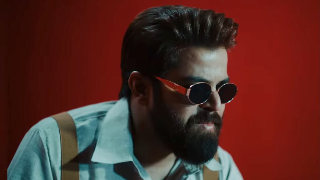 Masoom Sharma close-up with round red sunglasses and beard