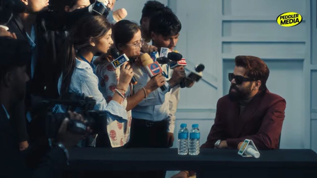 Masoom Sharma at press conference with multiple media microphones in front of him