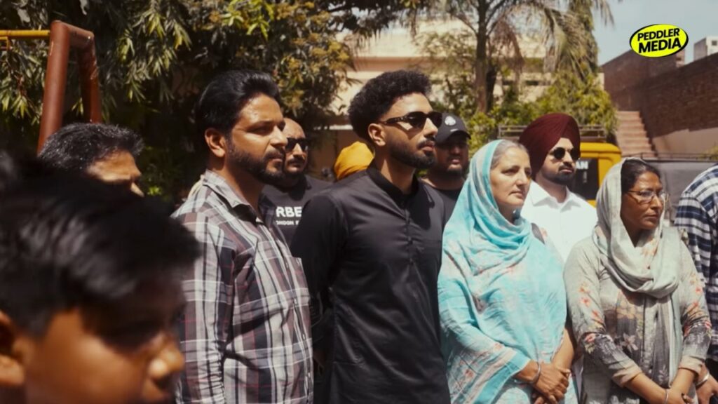 Navaan Sandhu with family members in a scene from Kath Lagda music video