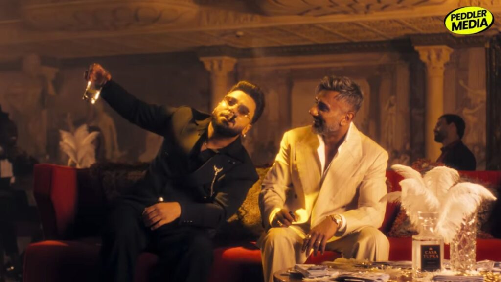 Rawme Hooda and Yo Yo Honey Singh sitting together in Jawani Iraqi official video