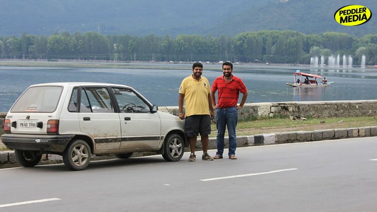 Two boys from Punjab standing next to their 1997 Maruti 800 PB 43 7700 at Dal Lake Srinagar during Leh road trip