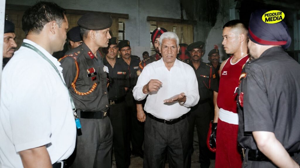 Honorary Captain Mehtab Singh mentoring and coaching young Indian Army boxers alongside military officers.