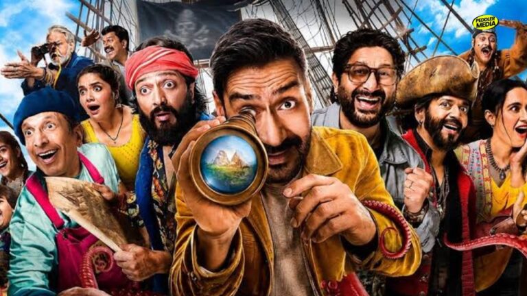 Dhamaal 4 review feature poster showing Ajay Devgn holding a telescope alongside Arshad Warsi, Riteish Deshmukh, and Jaaved Jaaferi.