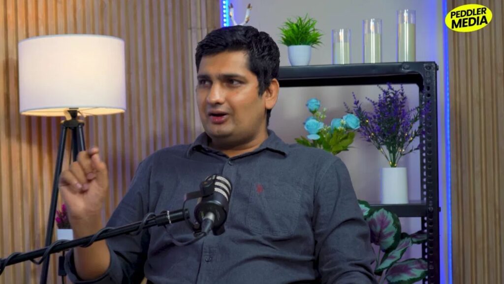 Close-up of journalist Mandeep Punia speaking during his Peddler Media podcast interview on Haryana's media and youth crisis