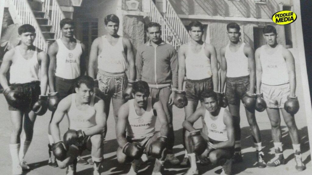 Archival black and white photo of the Indian national boxing team including pioneers Mehtab Singh and Hawa Singh during a training camp.