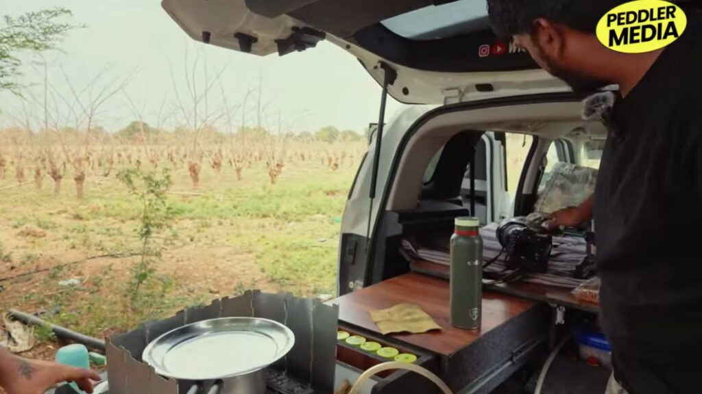 Vivek Sharma's camera gear and cooking setup inside his Tata Sierra parked in Jawai forest