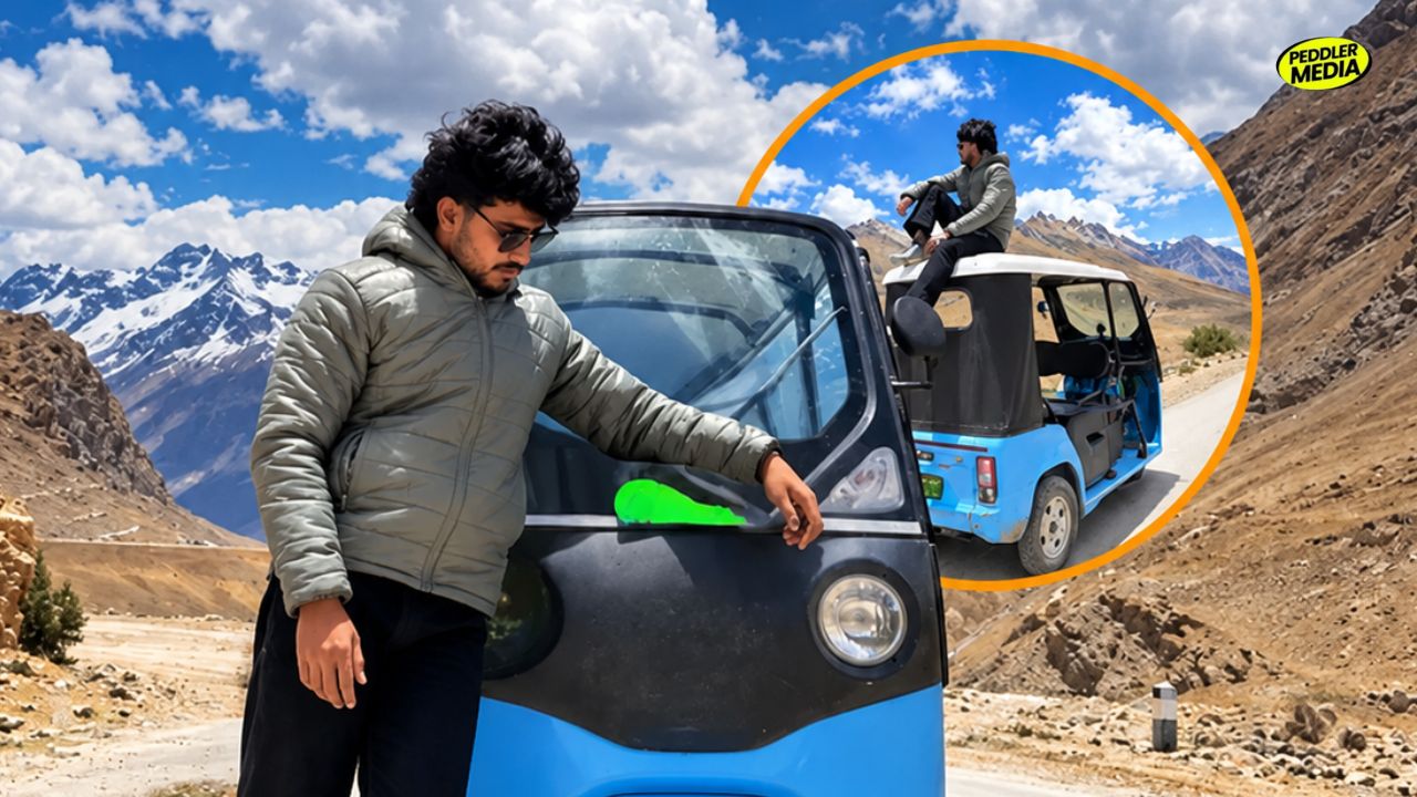 Sumit Prajapati looking at his blue vehicle during his historic e-rickshaw to Spiti Valley tour.