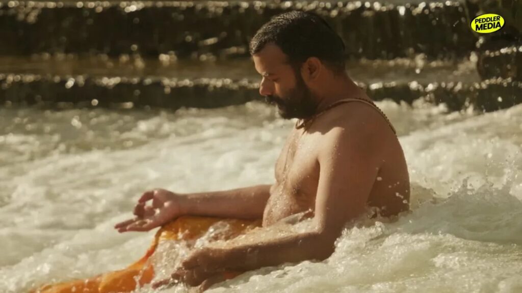 Hanuman Ansh movie meditation scene with lead actor sitting in river water