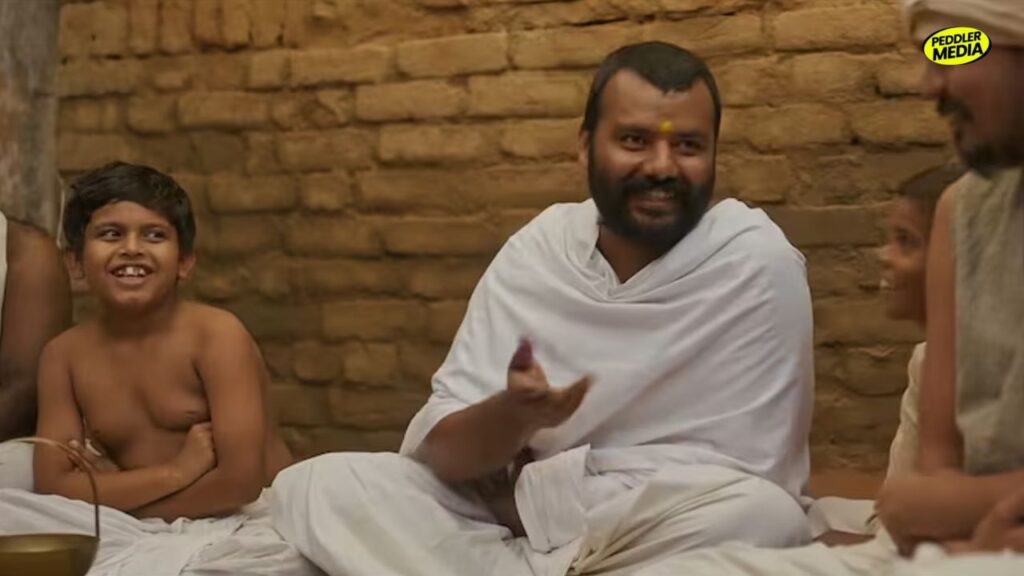 Hanuman Ansh movie scene with lead actor and children in a village setting