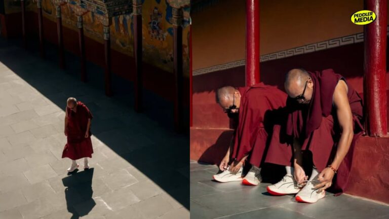 Monks wearing PUMA sneakers tie their laces at a Ladakh monastery, one monk walking alone in the courtyard