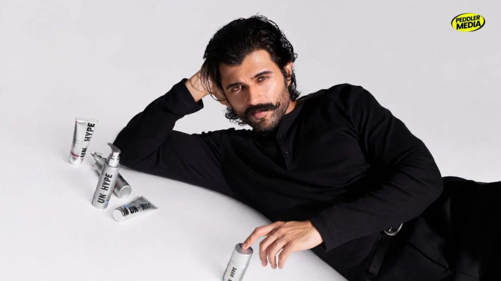 Vijay Deverakonda with his skincare brand Unhype products