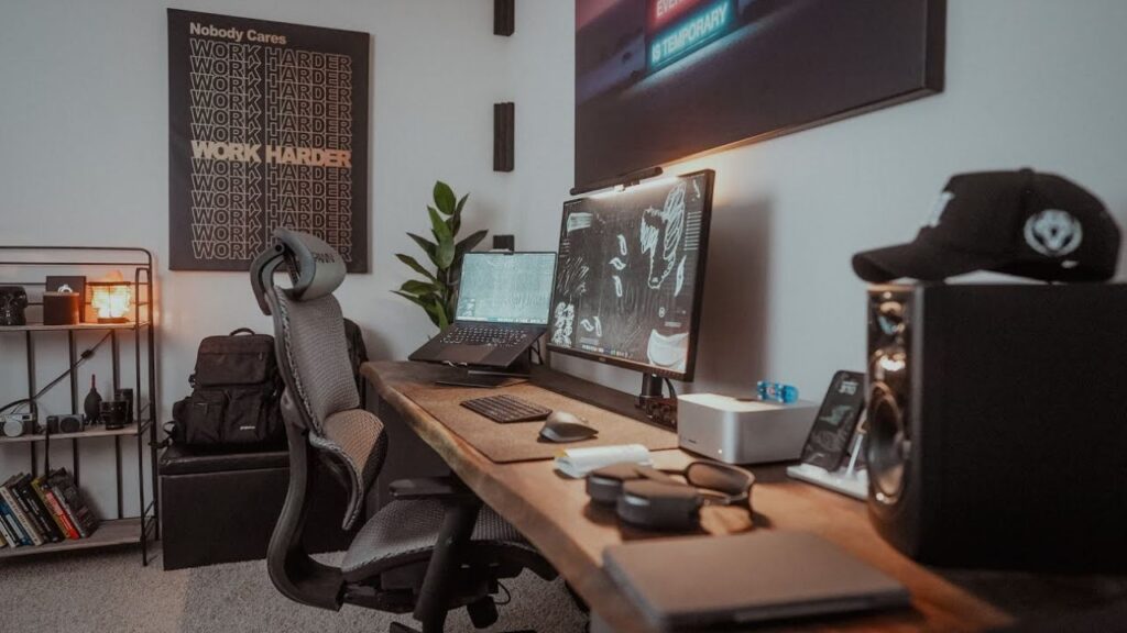 An aesthetic workspace setup showcasing the best Pro Products for home studio desk including an ultrawide monitor, Mac Studio, premium speakers, and camera gear.
